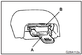 When the rear–centre three–point seat belt is not being used, stow the tongues