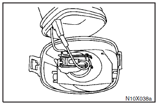 Unhook the spring which secures the bulb and then remove the bulb.