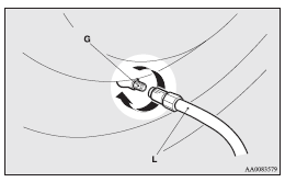 14. Place the compressor (M) with its air pressure gauge (N) on top.