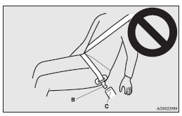 3. Insert the latch plate (E) into the buckle (F) until a “click” is heard.