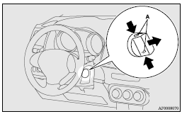 7. Insert the emergency key into the ignition switch.