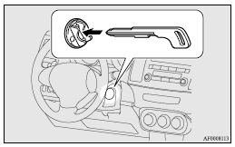 8. Insert the keyless operation key into the emergency key.