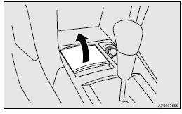 To remove the ashtray, open the lid and lift upward holding the lid.